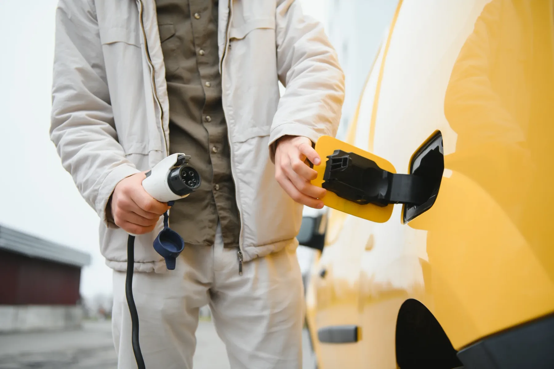 Electric vehicle connected to a charging station.